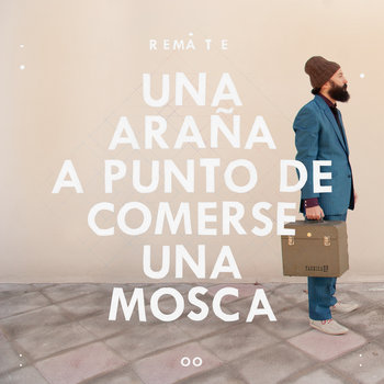 UNA ARAÑA A PUNTO DE COMERSE UNA MOSCA cover art